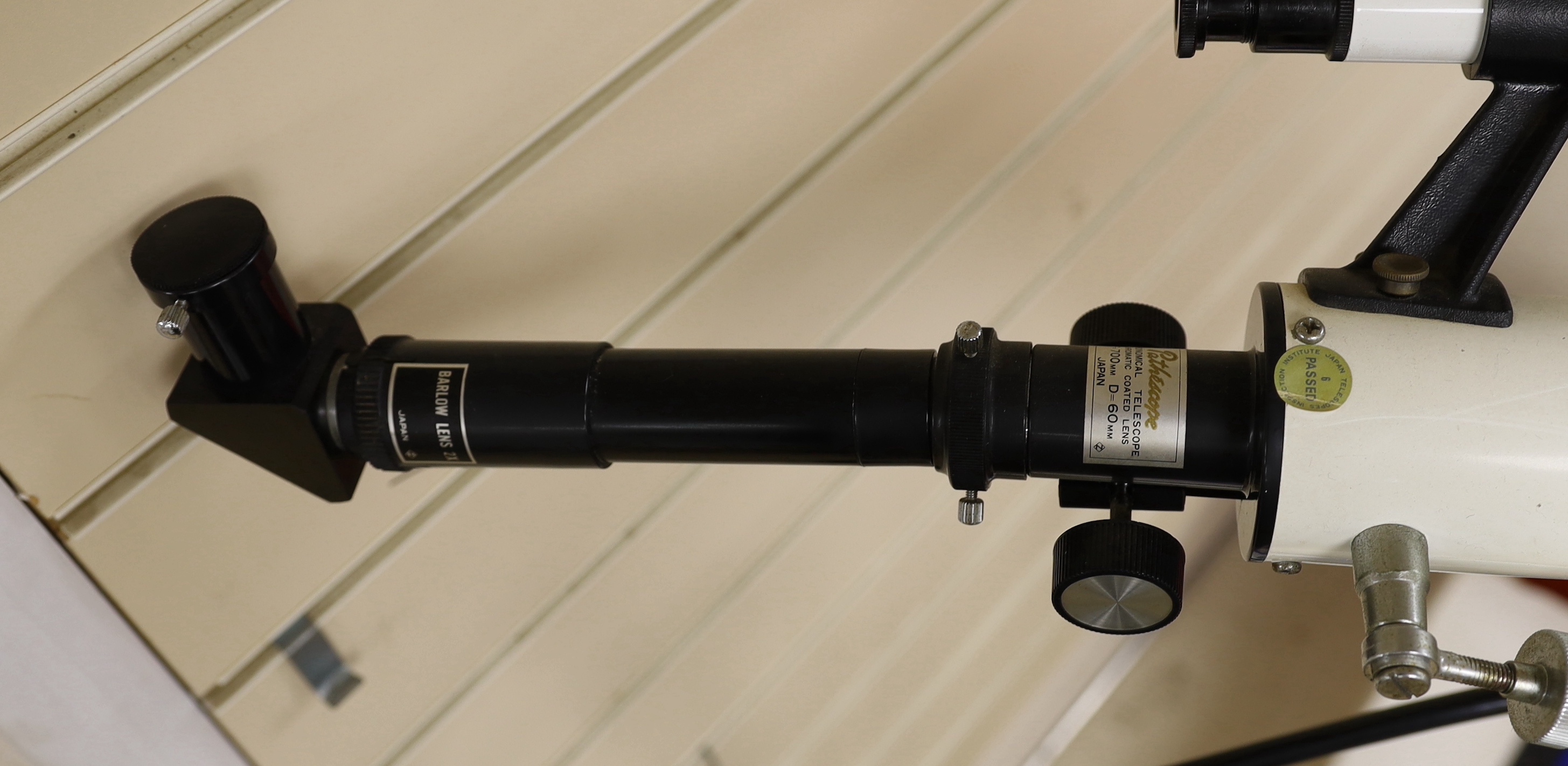 A telescope on tripod stand and a Meade scope and tripod, telescope and stand 105cm high